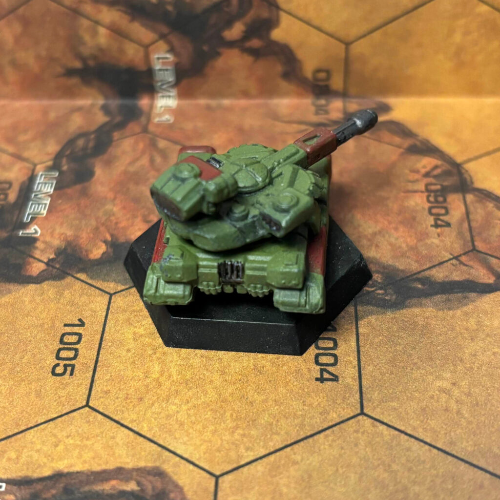 Manticore tank painted in olive drab with red highlights