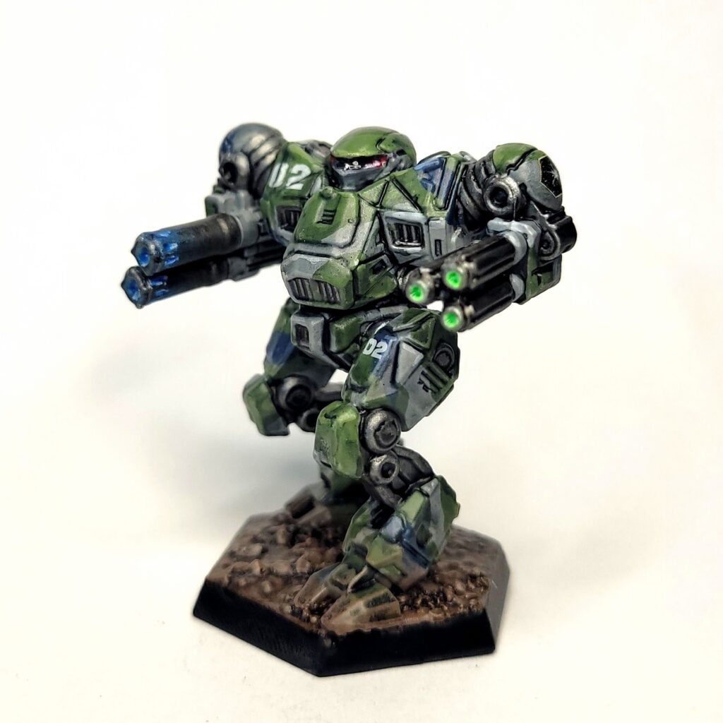 a Nova Cat miniature painted in green, grey, and blue camo