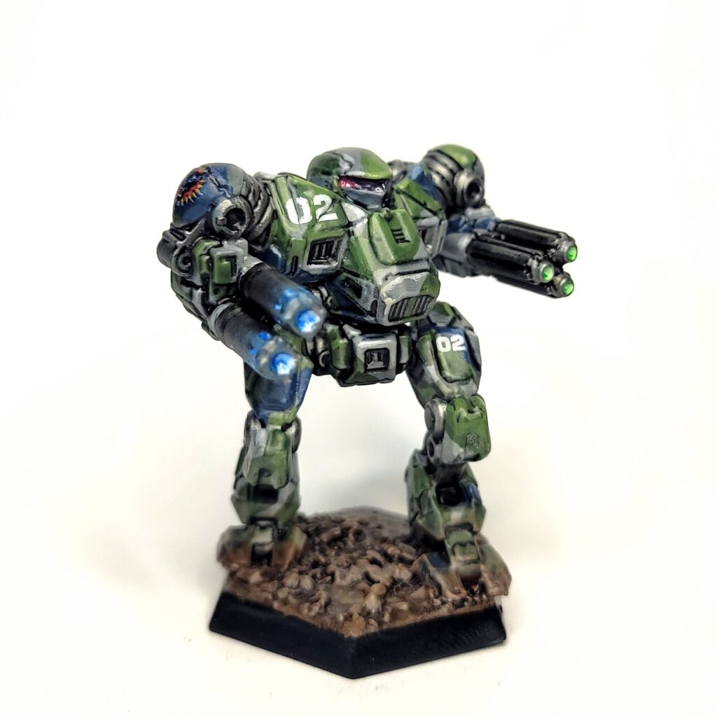 a Nova Cat miniature painted in green, grey, and blue camo