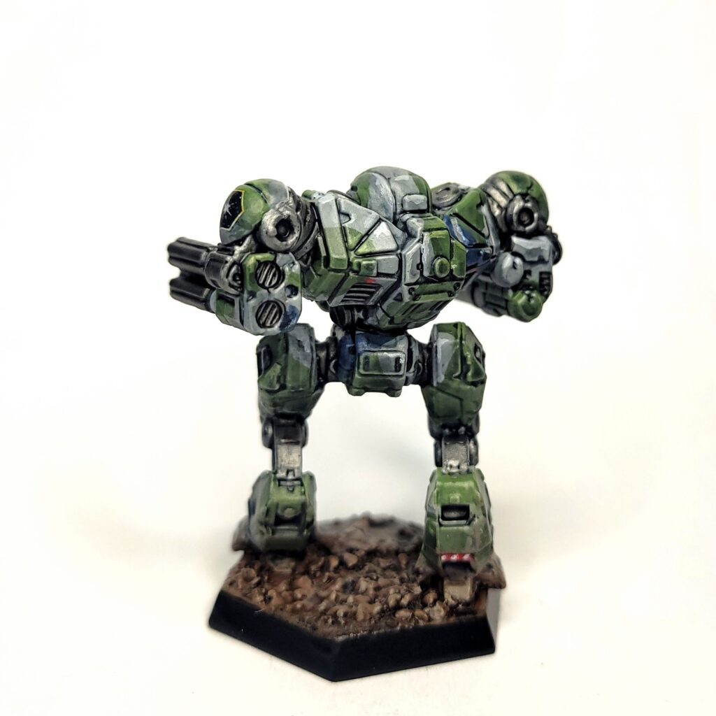 a Nova Cat miniature painted in green, grey, and blue camo