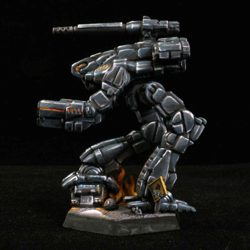 a Marauder miniature painted black with kitbashed terrain