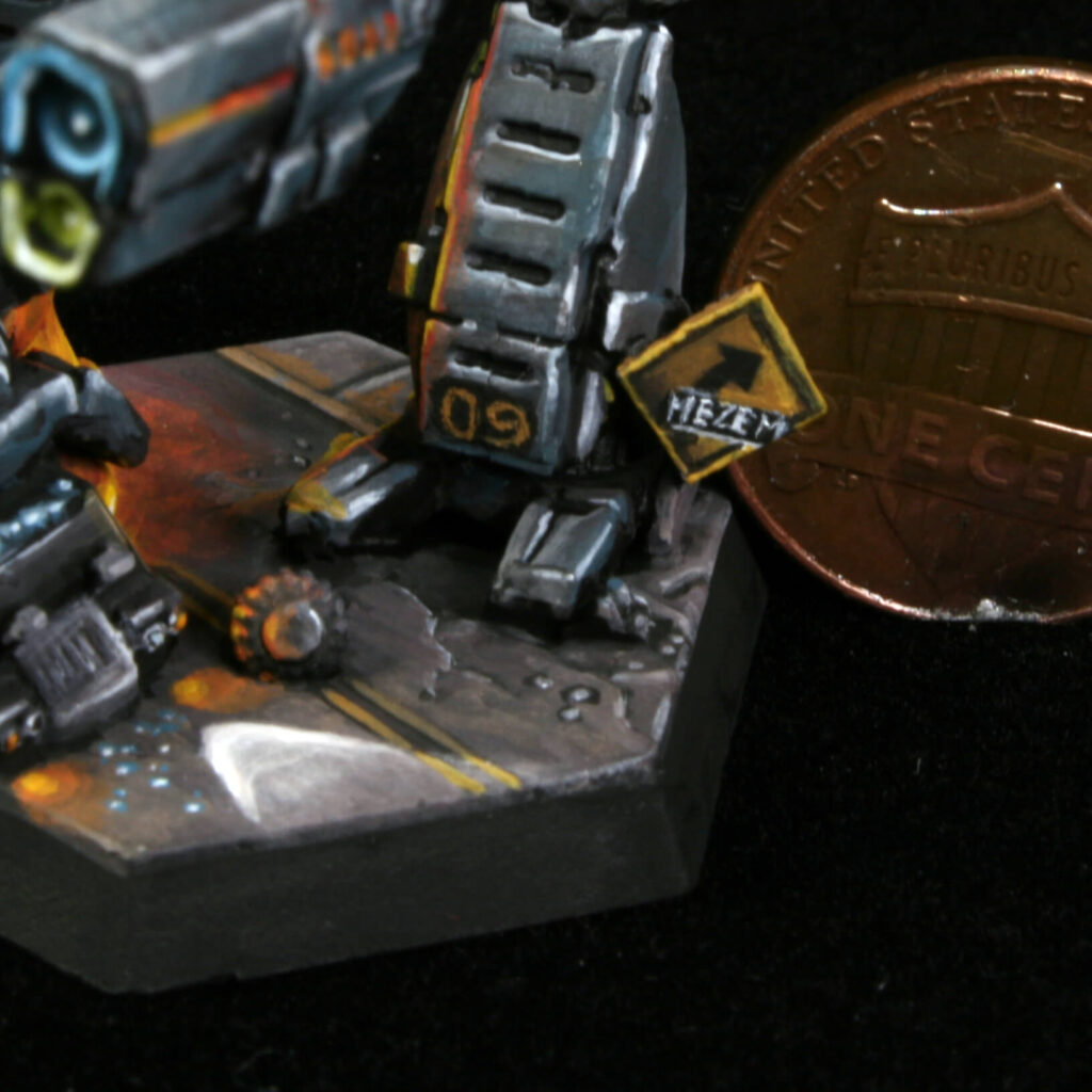 a detail shot of a Marauder miniature painted black with kitbashed terrain