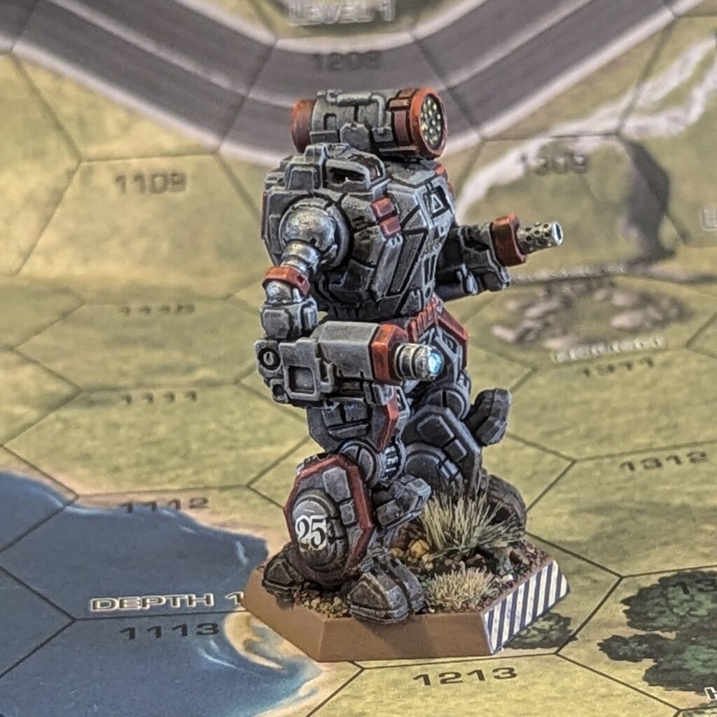 a Summoner miniature painted grey with red accents