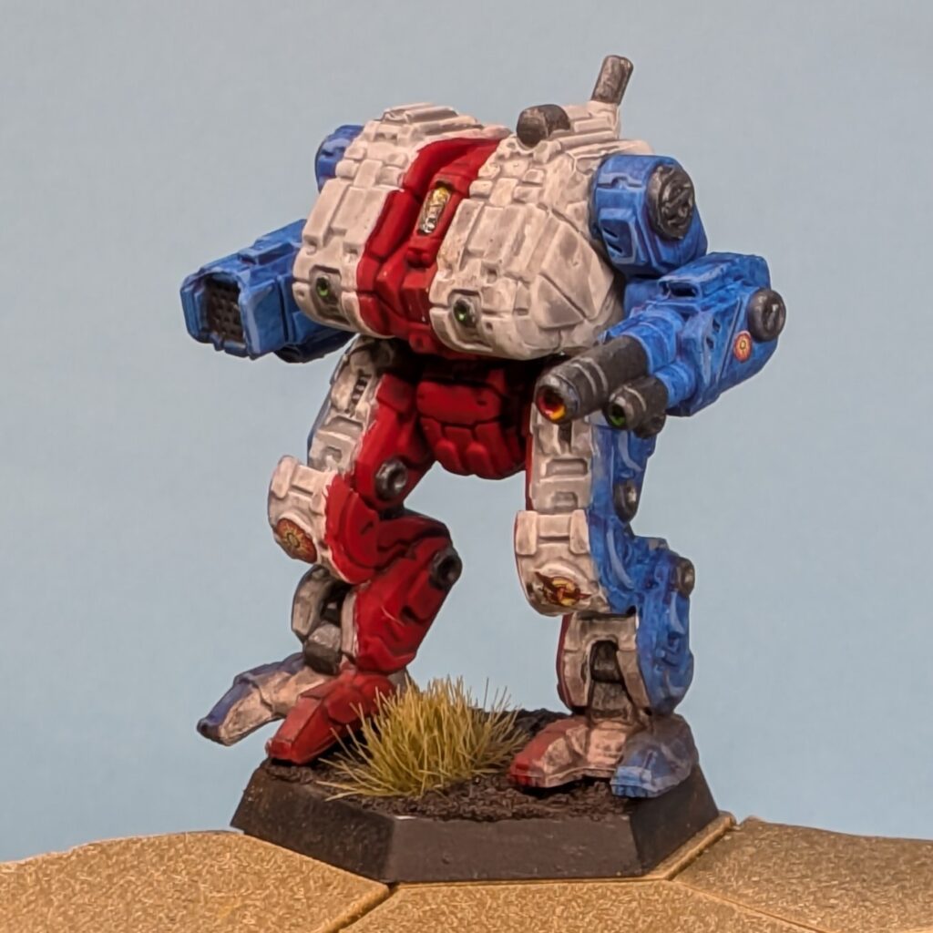a Thanatos miniature painted in vertical stripes, blue to white to red in the center