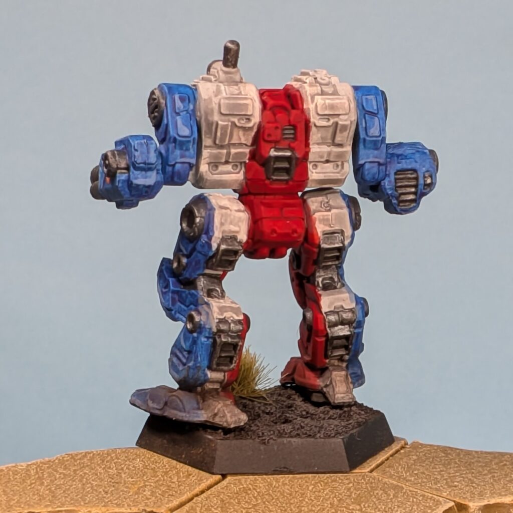 a Thanatos miniature painted in vertical stripes, blue to white to red in the center