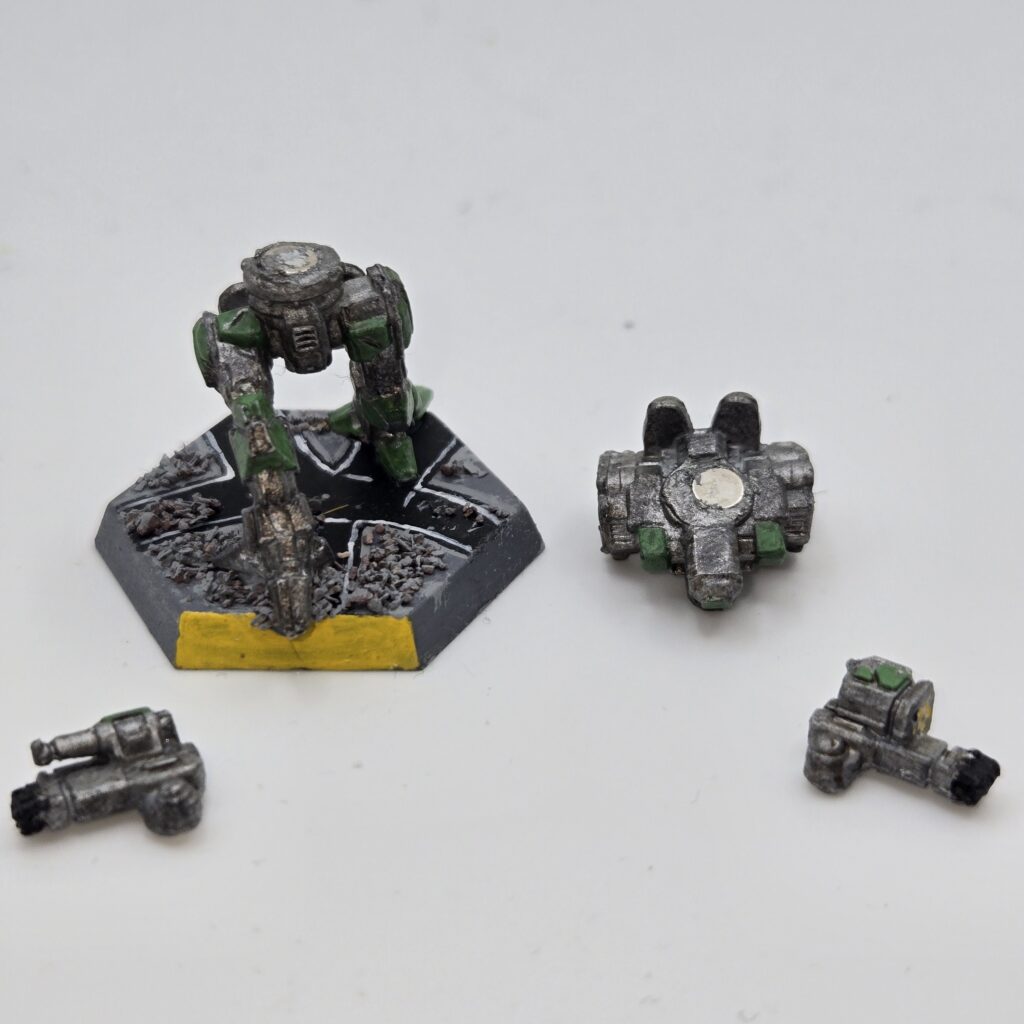 Fire Moth miniature painted metallic grey with green accents. The torso and arms have been magnetized and disassembled