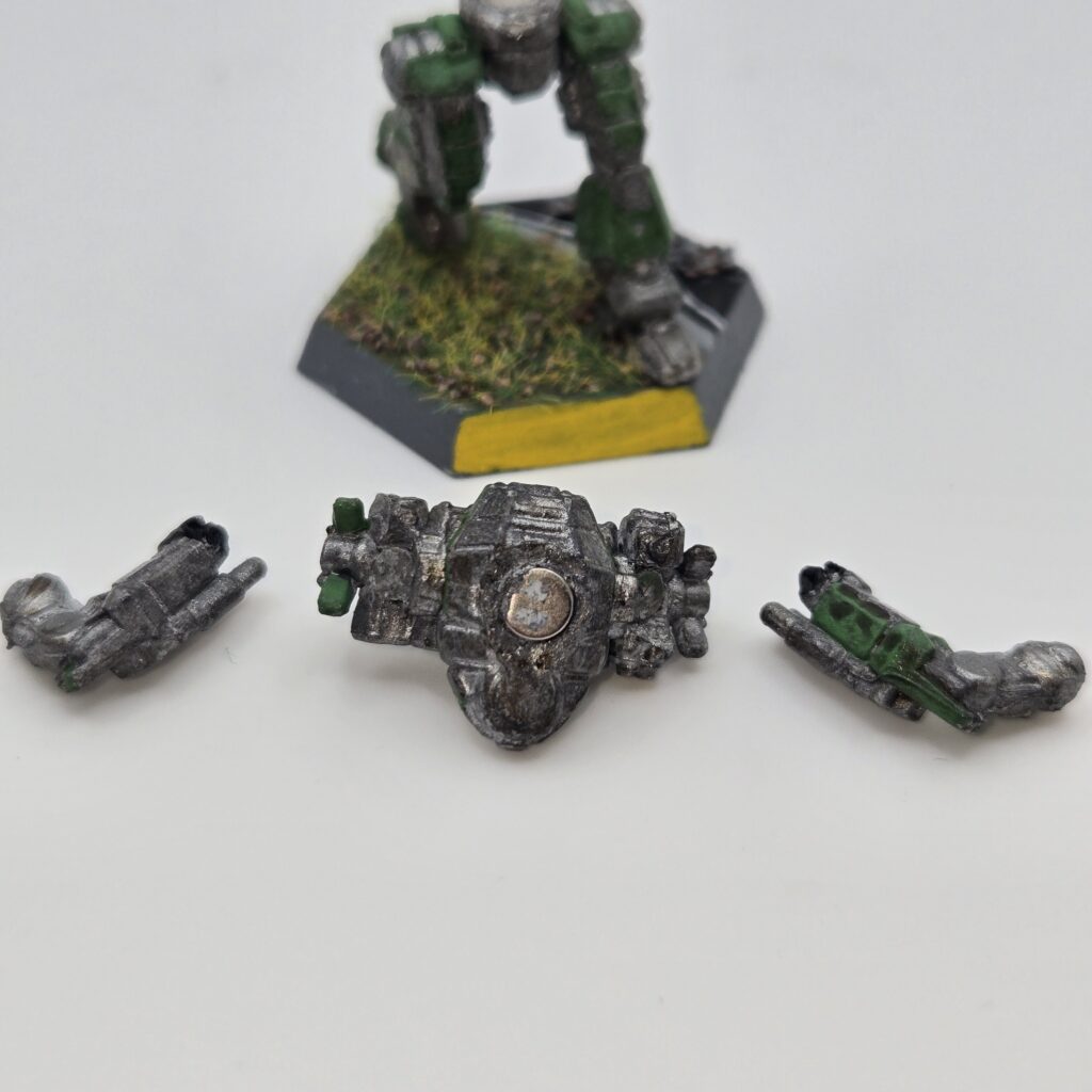 Hellion miniature painted metallic grey with green accents. The torso and arms have been magnetized and disassembled
