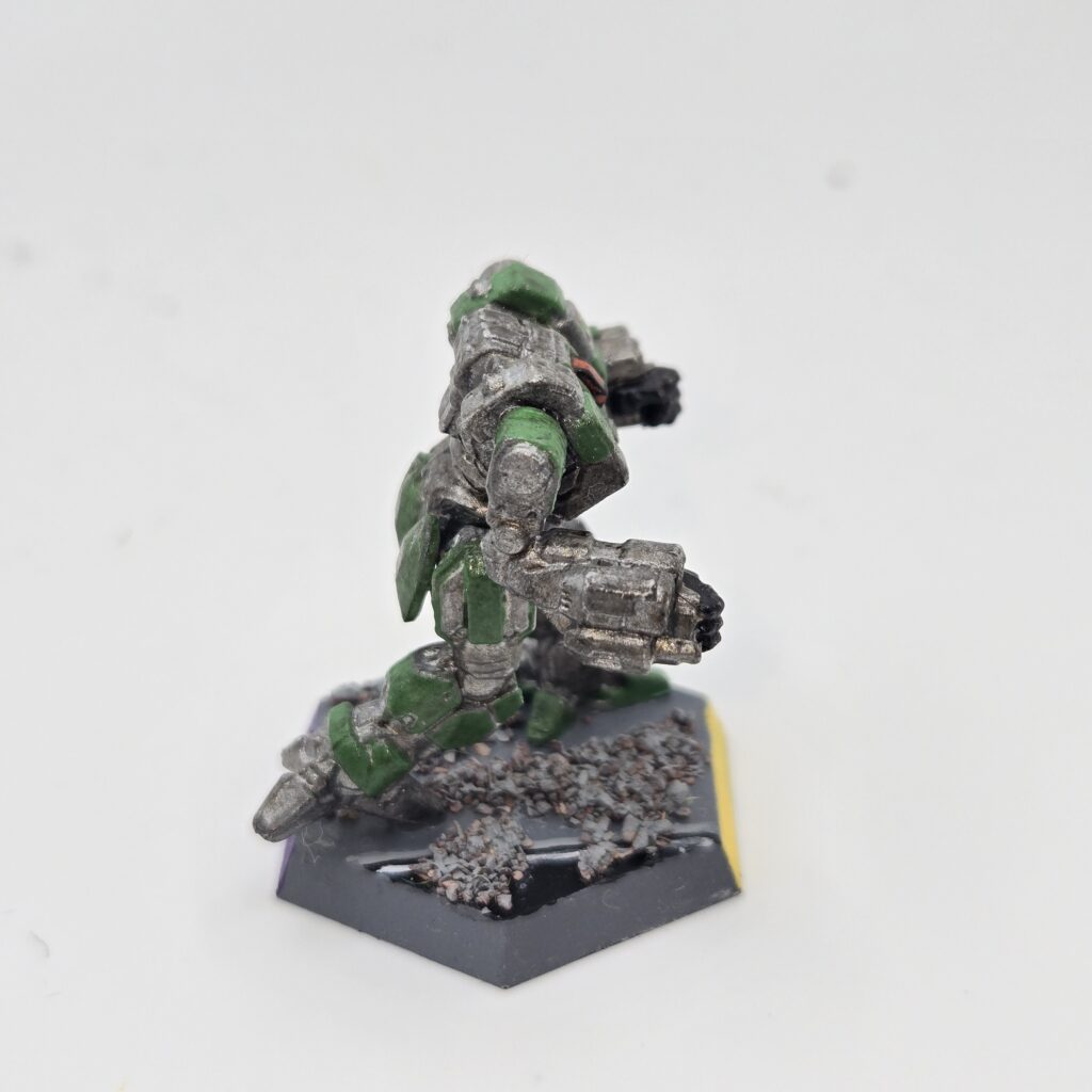 Mist Lynx miniature painted metallic grey with green accents
