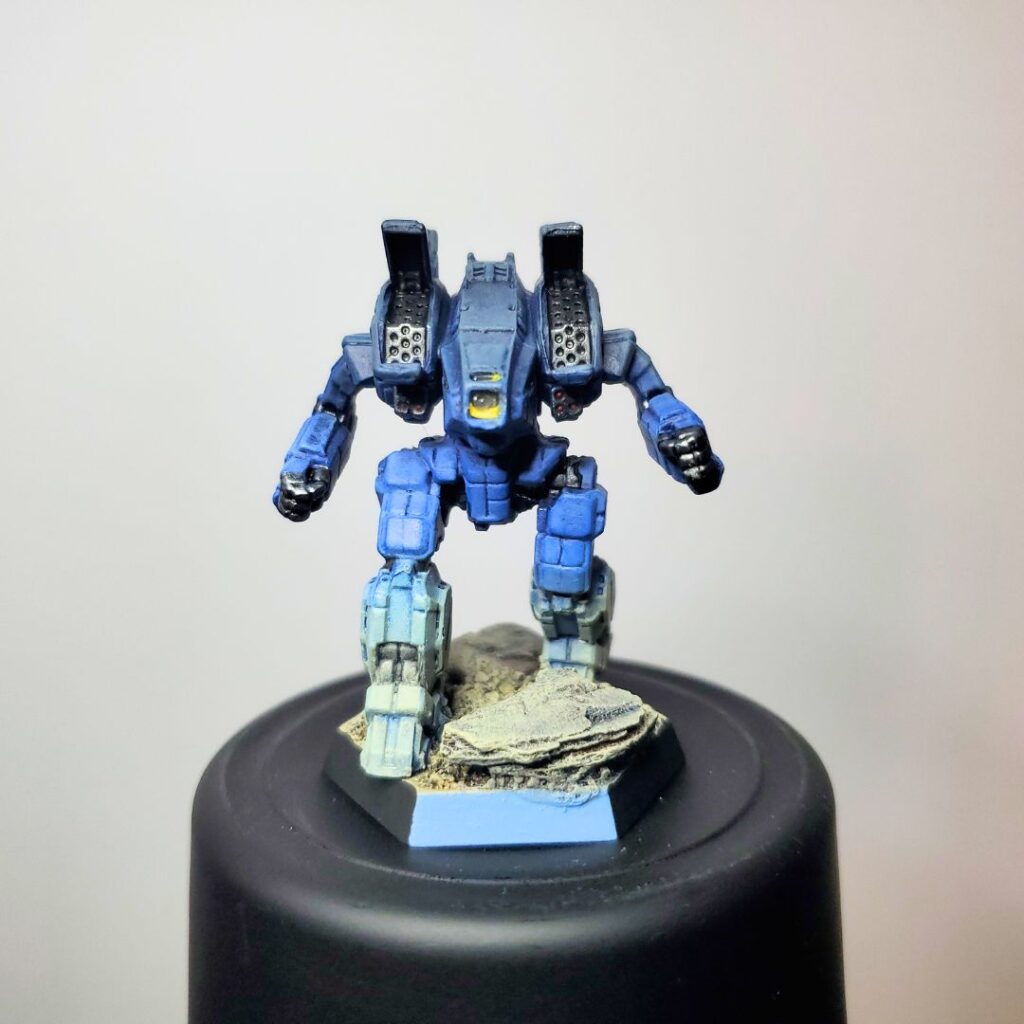 an Archer miniature painted in a grey-to-blue gradient