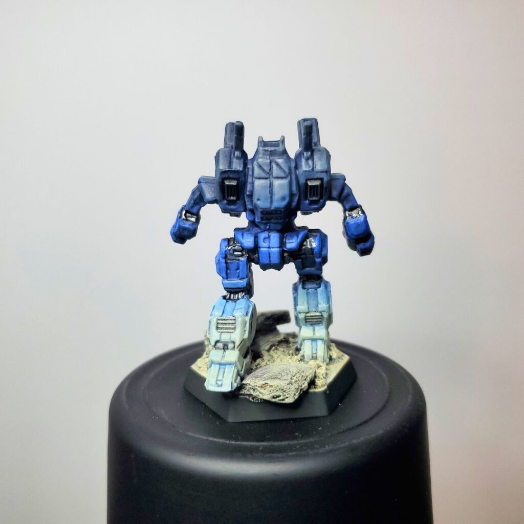 an Archer miniature painted in a grey-to-blue gradient