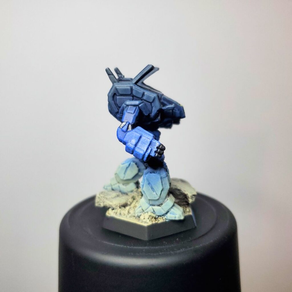 an Archer miniature painted in a grey-to-blue gradient