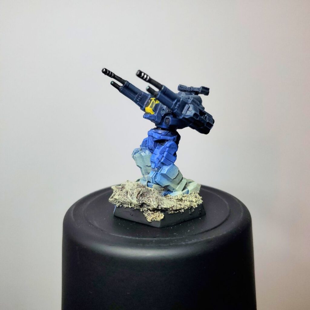 a Rifleman miniature painted in a grey-to-blue gradient