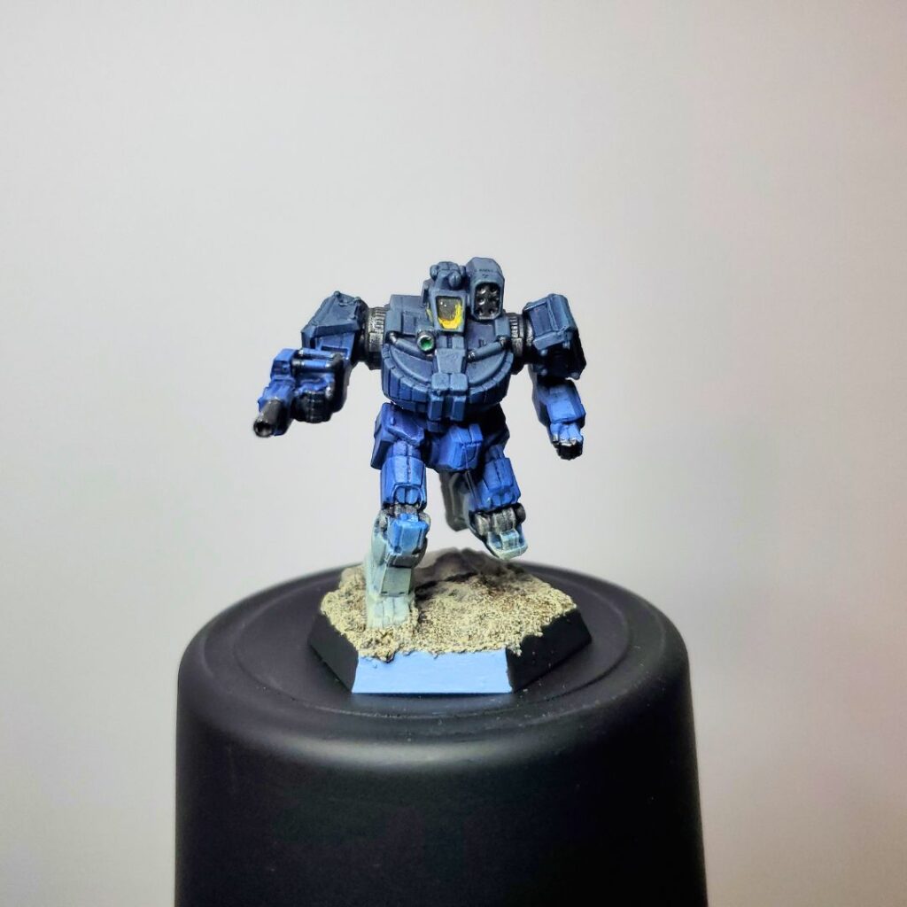a Wolverine miniature painted in a grey-to-blue gradient