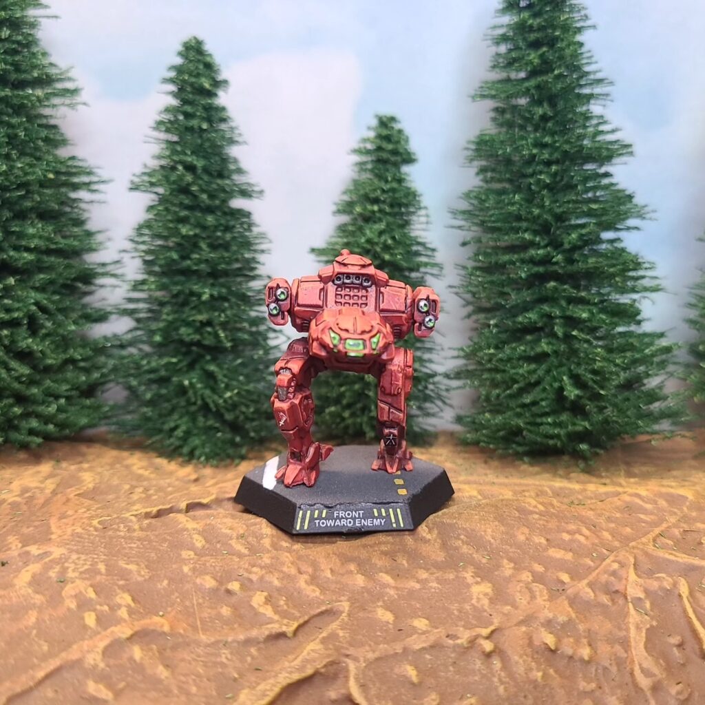 a Jenner miniature painted red with green cockpit accents
