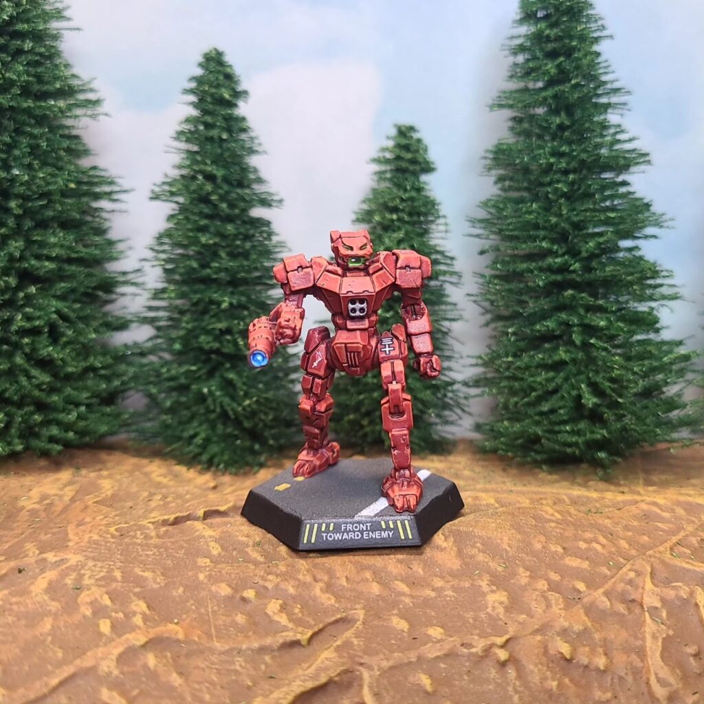a Panther miniature painted red with green cockpit accents