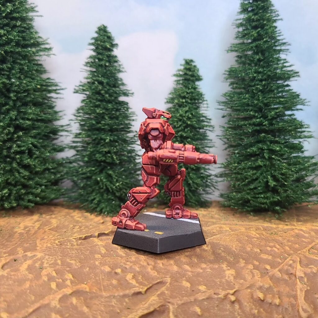 a Panther miniature painted red with green cockpit accents