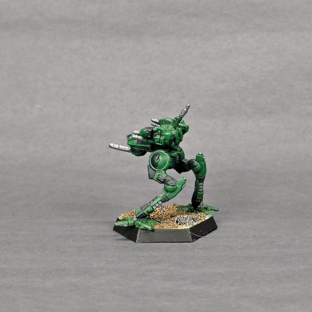 a Locust miniature painted green with black accents