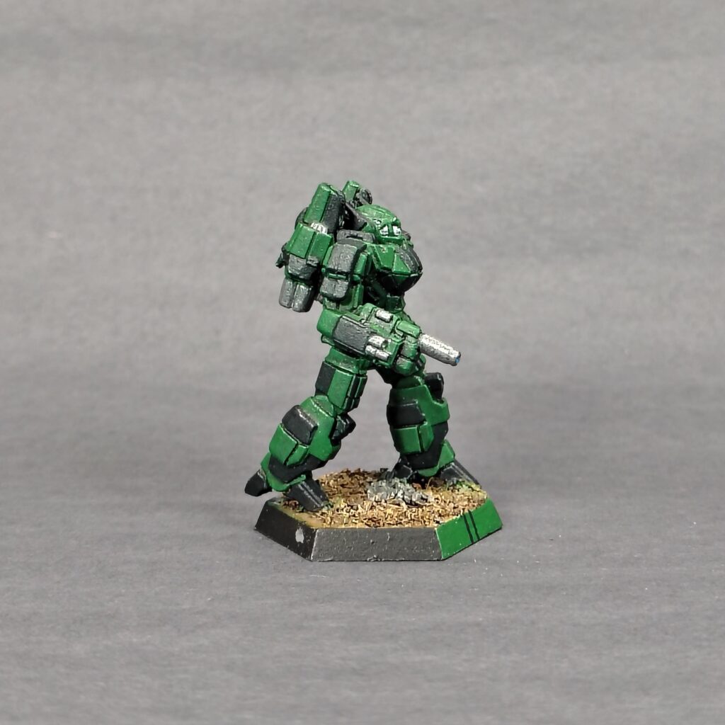 a Phoenix Hawk miniature painted green with black accents