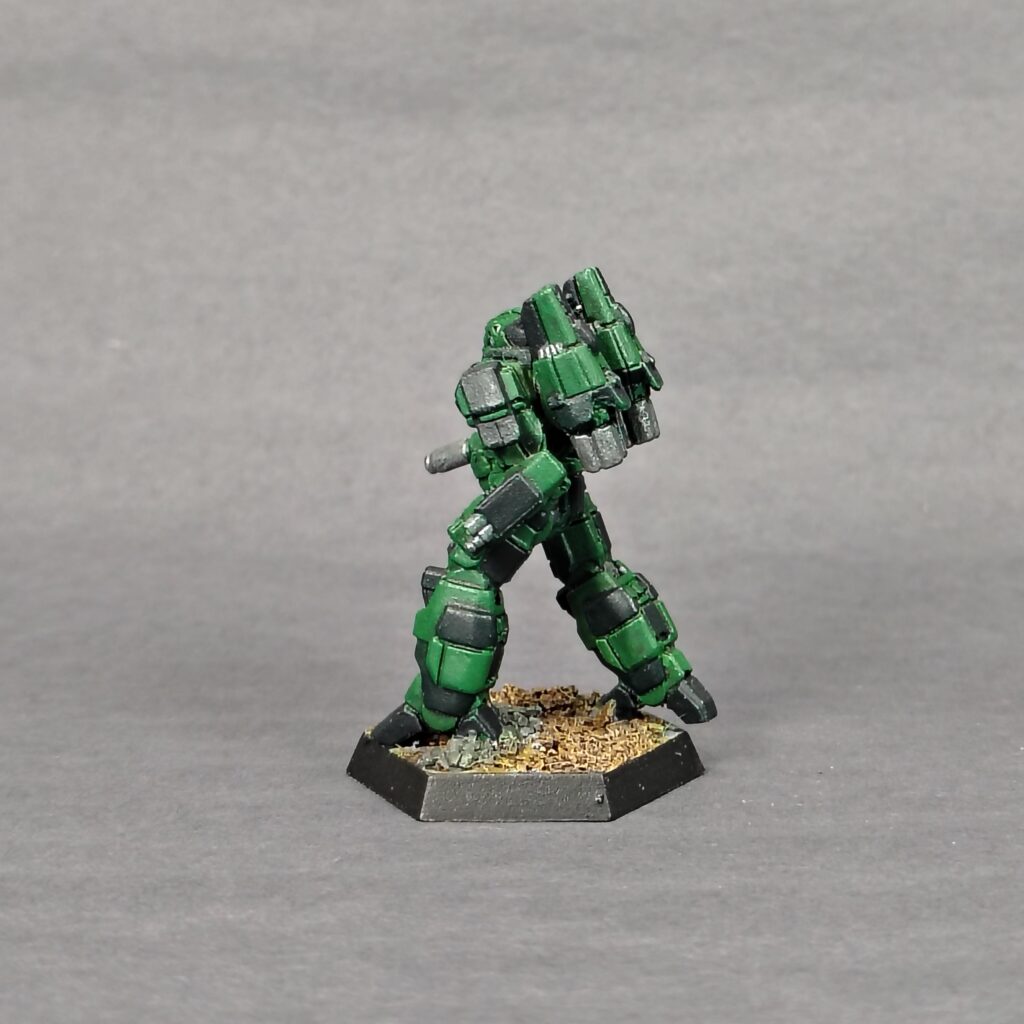 a Phoenix Hawk miniature painted green with black accents