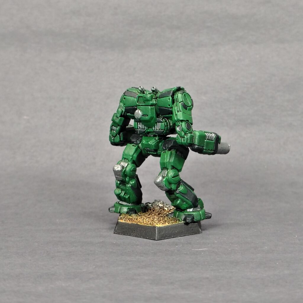 a Thug miniature painted green with black accents