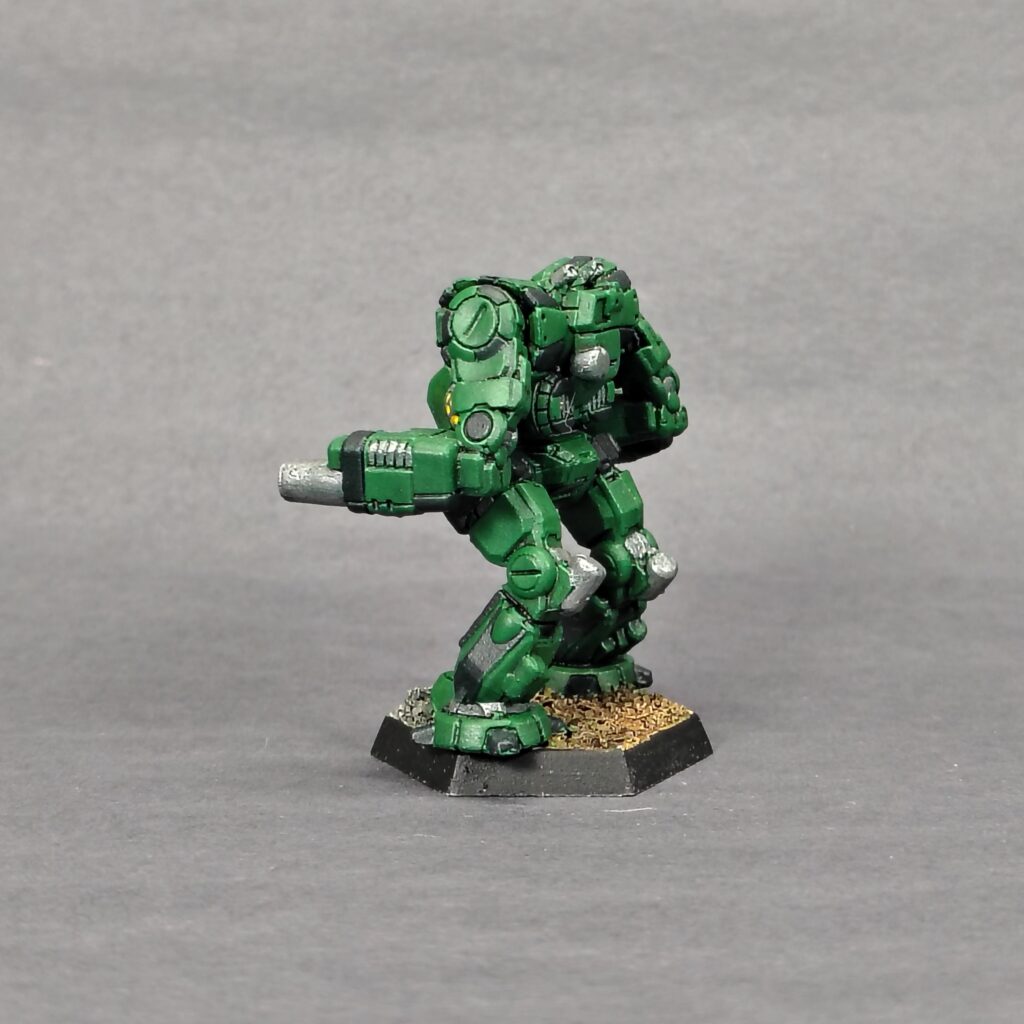 a Thug miniature painted green with black accents