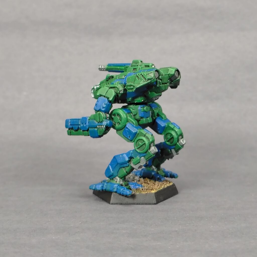 a Marauder II miniature painted green with blue accents
