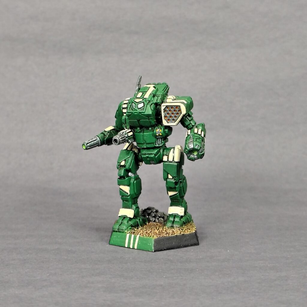 an Orion miniature painted green with ivory accents