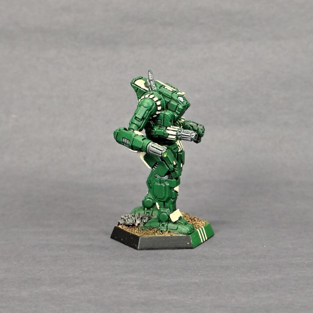 an Orion miniature painted green with ivory accents