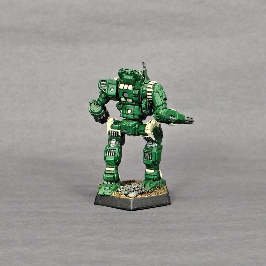 an Orion miniature painted green with ivory accents
