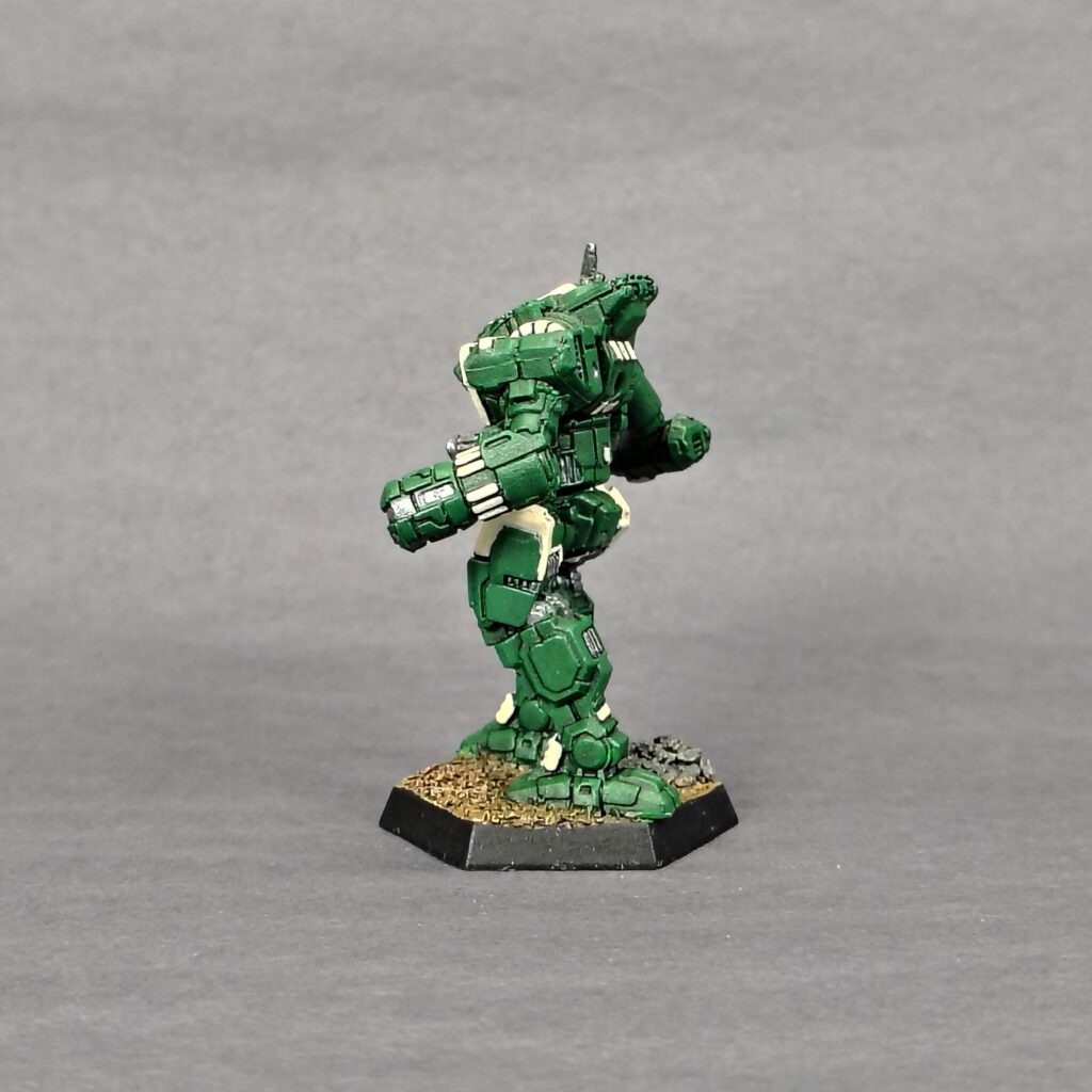 an Orion miniature painted green with ivory accents