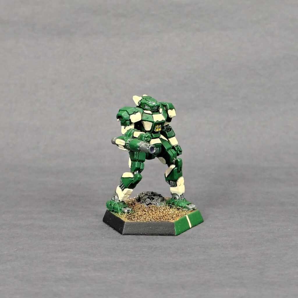 a Panther miniature painted green with ivory accents