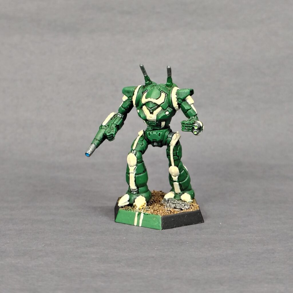 a Wraith miniature painted green with ivory accents
