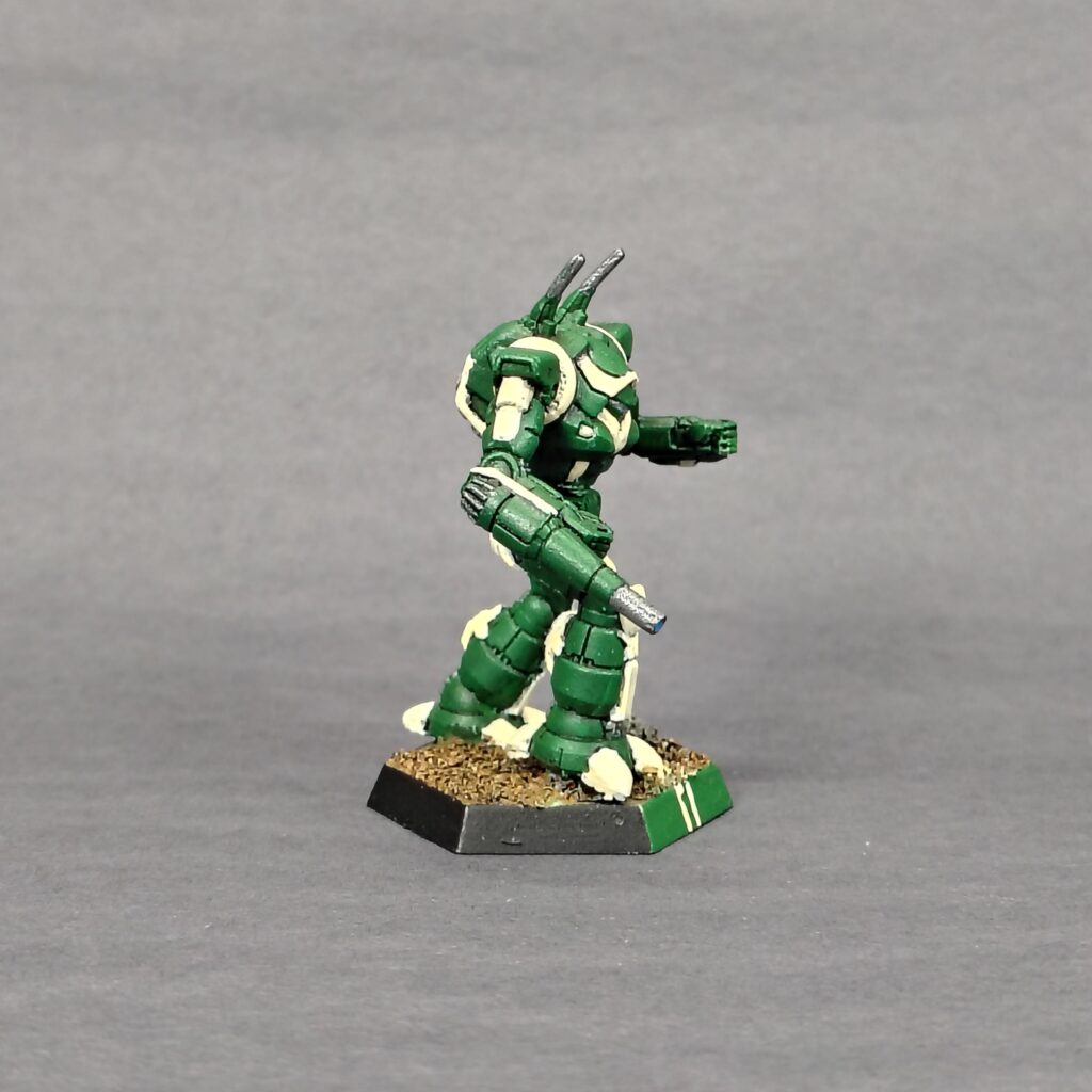 a Wraith miniature painted green with ivory accents