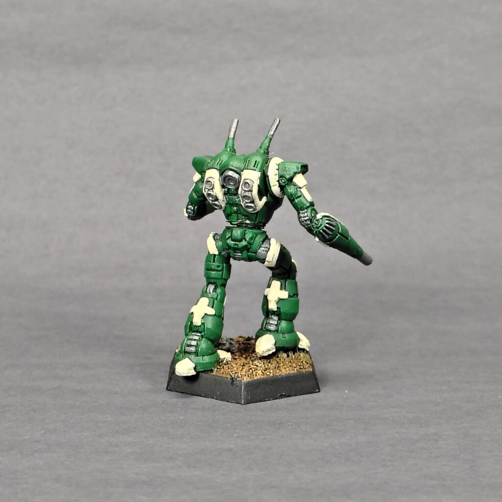 a Wraith miniature painted green with ivory accents
