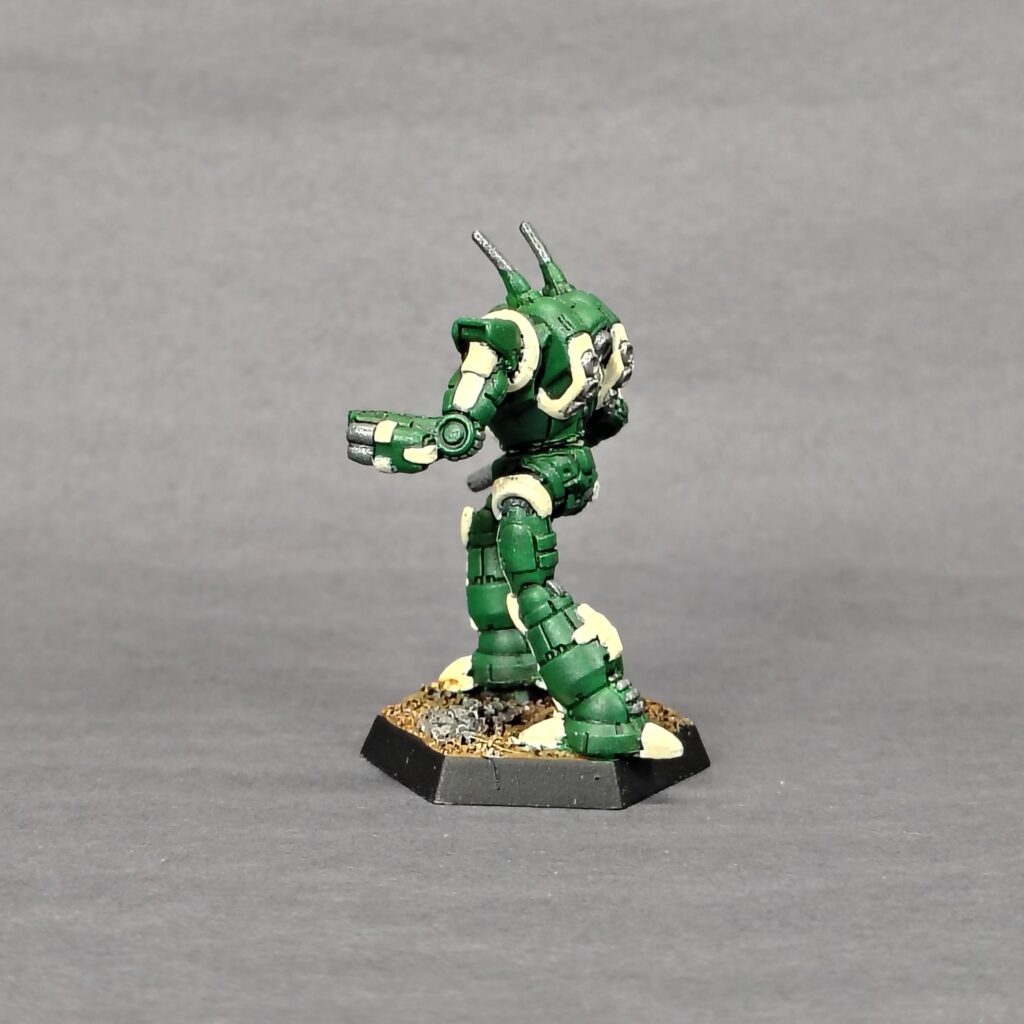 a Wraith miniature painted green with ivory accents